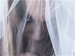 Stacey Hopkins plowing her boy in a bridal veil